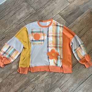 Colorful Patchwork Plaid Sweater with Floral Design